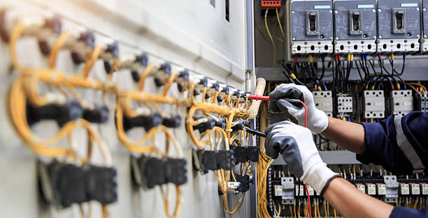 Professional Electrician technician working in Feather Sound, FL